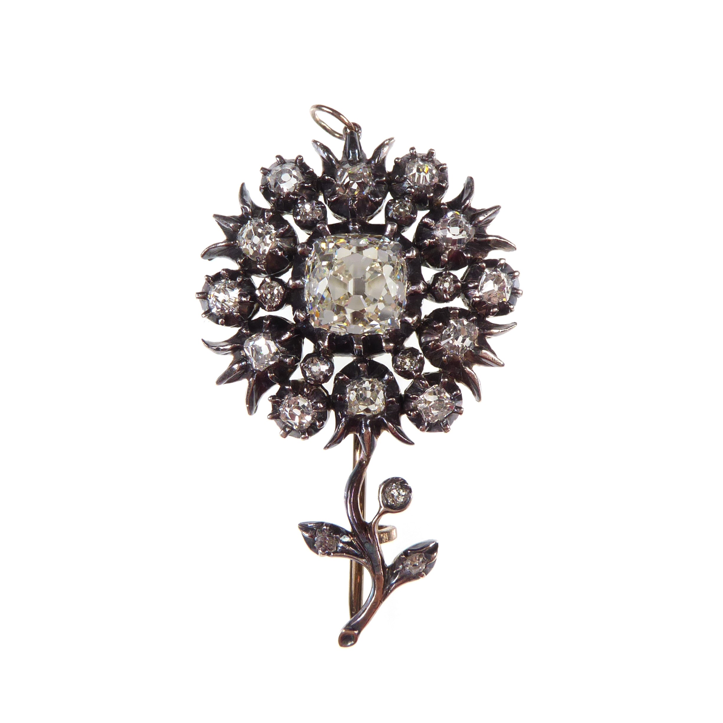 Later 19th century cushion cut diamond cluster flower pendant-brooch, c.1890, in the manner of the mid-18th century style, centre stone approximately 3.00ct,